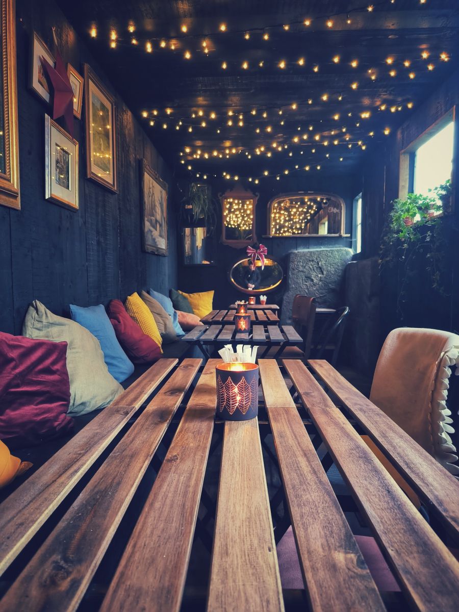 Candlelit tables inside the Potting Shed Cafe